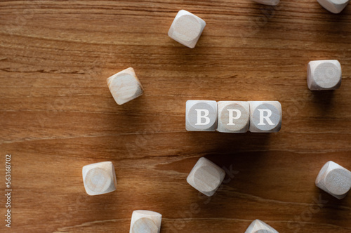 There is wood cubes with the word BPO. It's an abbreviation for Business Process Outsourcing.