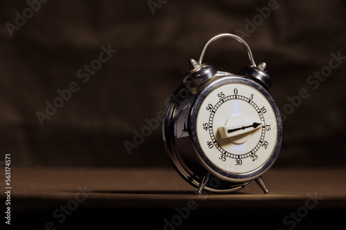 Retro antique clock timer with bell alarm side view