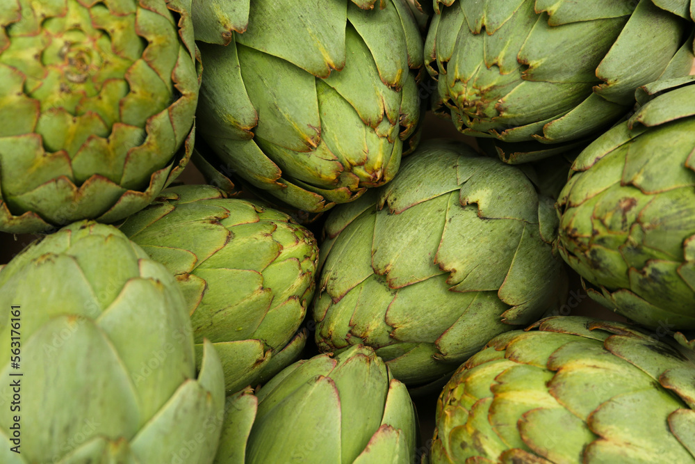 Fototapeta premium Many fresh raw artichokes as background, top view