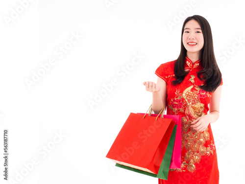 Принти на полотні Asian pretty young lady holding wow sale shopping red paper bag and wearing trad