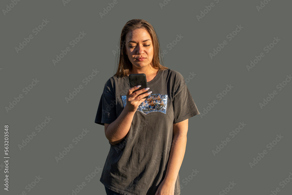 Young woman with a telephone - talking, writes a message, looks into the smartphone Young woman with a telephone - talking, writes a message, looks into the smartphone