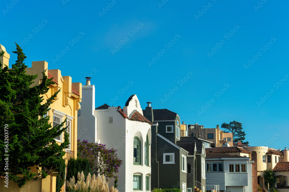 Row of modern decorative houses in the historic districts of san francisco california downtown in afternoon sun