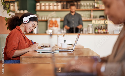 Картината върху платно Woman, student and studying in cafe, laptop and make notes for exams, smile and concentration for test