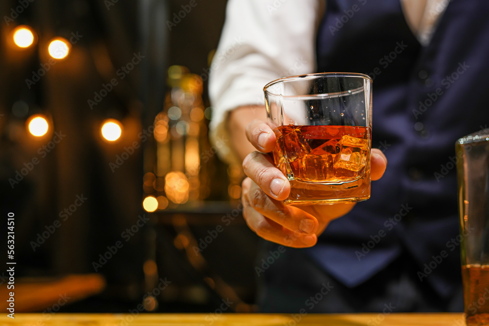 Bartender pouring Whiskey, on  bar,