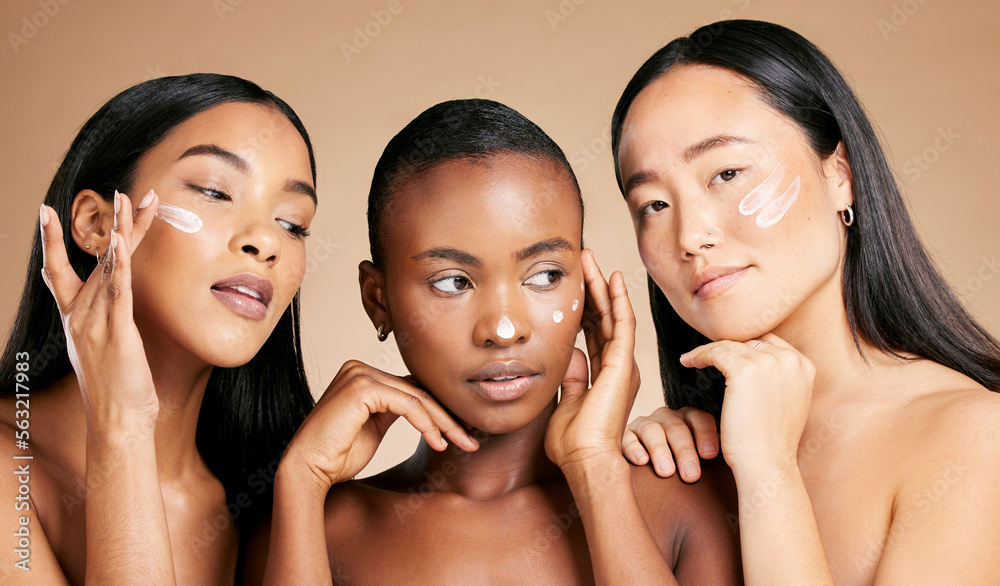 © Jade M/peopleimages.com - Face cream, skincare and women in studio for wellness, grooming and hygiene against brown background. Friends, beauty and lotion for girl group with different, facial and skin product while isolated © Jade M/peopleimages.com - Face cream, skincare and women in studio for wellness, grooming and hygiene against brown background. Friends, beauty and lotion for girl group with different, facial and skin product while isolated