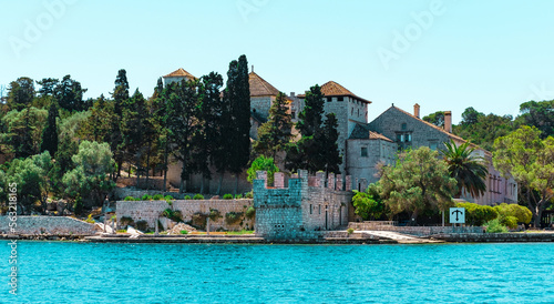 Mljet island, Croatia - 20 May 2022 : Veliko jezero or big lake Benedictine monastery view, historical popular tourist destination, ancient building and landmark, amazing nature © Ela