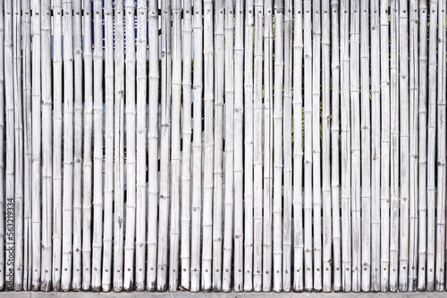 Old bamboo wood fence texture with seamless vertical patterns light white grey background and space