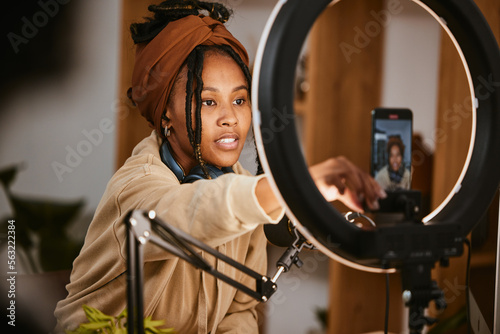 Communication, phone and influencer broadcast podcast, radio talk show or speaker talking about teen culture. Presenter microphone, black woman setup streaming or speaking about online student news