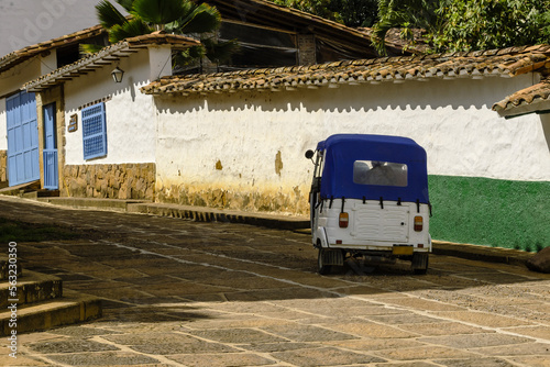 Mototaxi in a stone paved street of Barichara, Santander, Colombia. photo