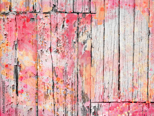 Authentic old worn white peeling painted wall boards with  splashes of colorful magenta and orange. Paint splatter textured spring summer background. with copy space negative space on right.
