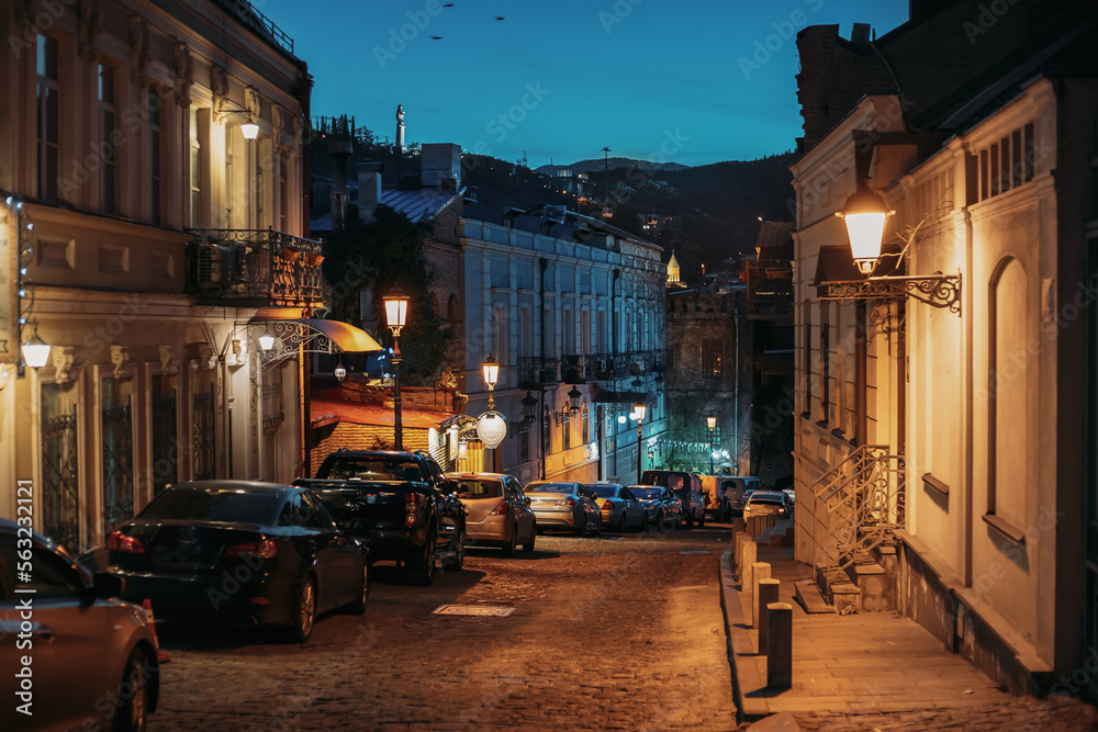 Night View Of City Streets Of Tbilisi. Parked Cars In A Row On A Street Of Tbilisi.