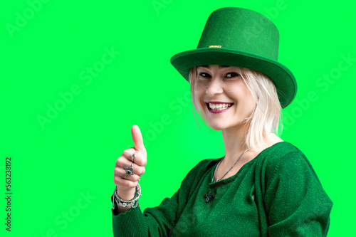 Beautiful smiling woman wearing green hat. St. Patrick's Day celebration.