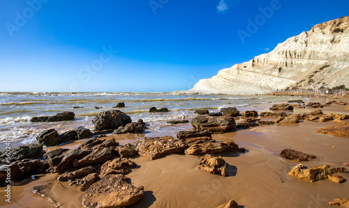 View of the limestone white cliffs with the beach at Stair of the Turks or Turkish Steps near Realmonte in Agrigento province. Sicily, Italy photo