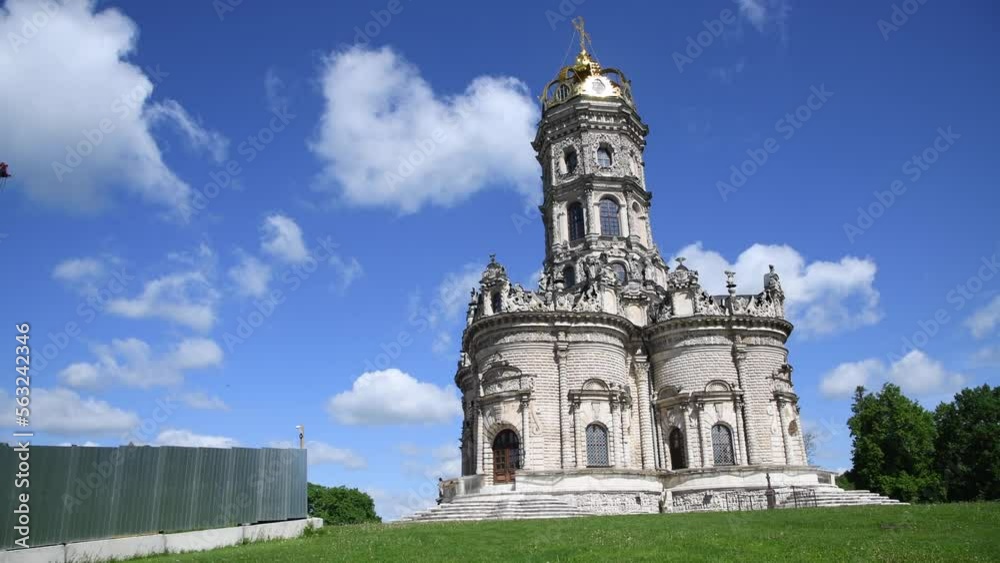 View of the Church of the Sign of the Blessed Virgin Mary in Dubrovitsy in a sunny summer day against cloudy sky. Real time video. Religious architecture theme. View of the Church of the Sign of the Blessed Virgin Mary in Dubrovitsy in a sunny summer day against cloudy sky. Real time video. Religious architecture theme.