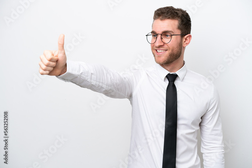 Young business caucasian man isolated on white background giving a thumbs up gesture