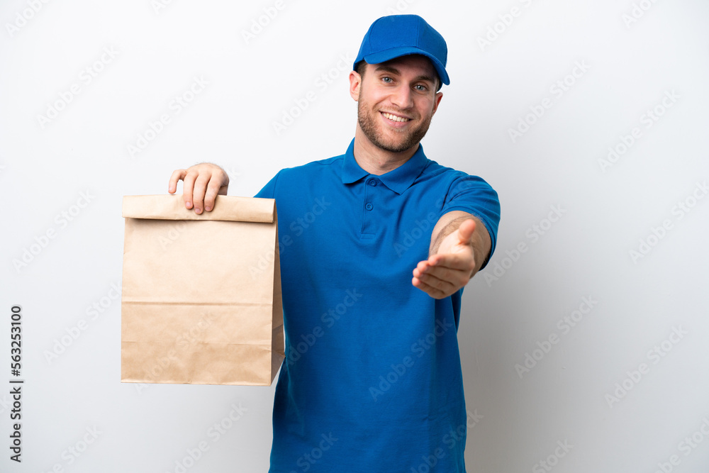Delivery caucasian man isolated on white background shaking hands for closing a good deal Delivery caucasian man isolated on white background shaking hands for closing a good deal
