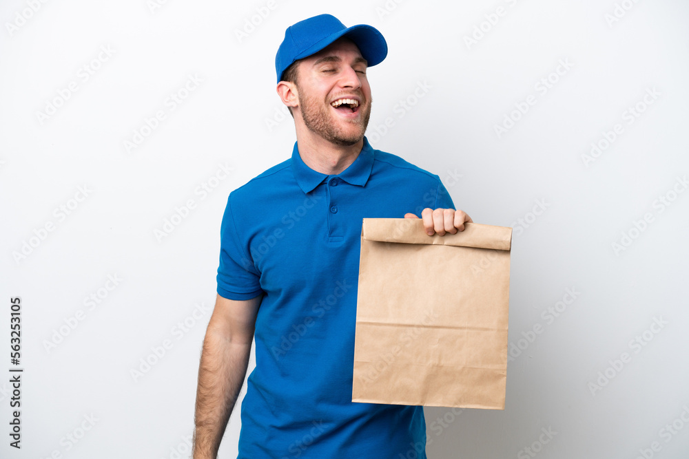Delivery caucasian man isolated on white background laughing Delivery caucasian man isolated on white background laughing