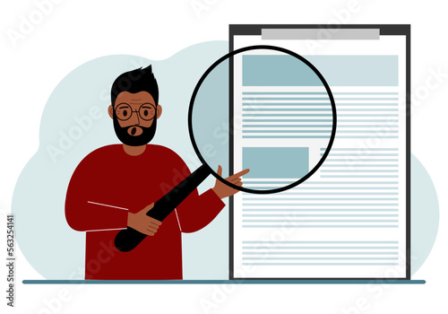 A man holds a magnifying glass and examines a document, contract or agreement. The concept of a lawyer, businessman, or attorney at work.