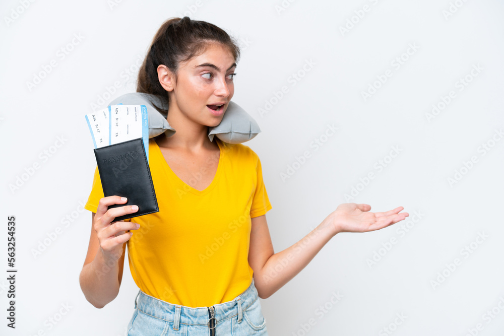 Young caucasian woman with Inflatable travel pillow isolated on white background with surprise expression while looking side Young caucasian woman with Inflatable travel pillow isolated on white background with surprise expression while looking side