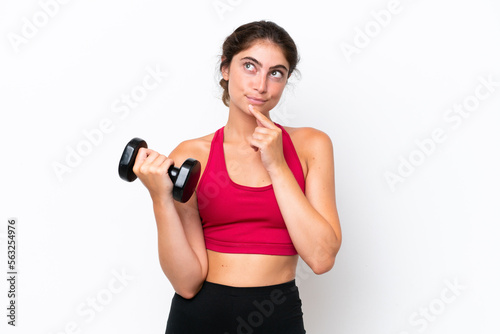 Young sport caucasian woman making weightlifting isolated on white background having doubts and thinking