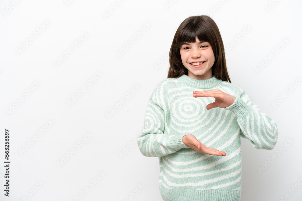 Little caucasian girl isolated on white background holding copyspace imaginary on the palm to insert an ad Little caucasian girl isolated on white background holding copyspace imaginary on the palm to insert an ad