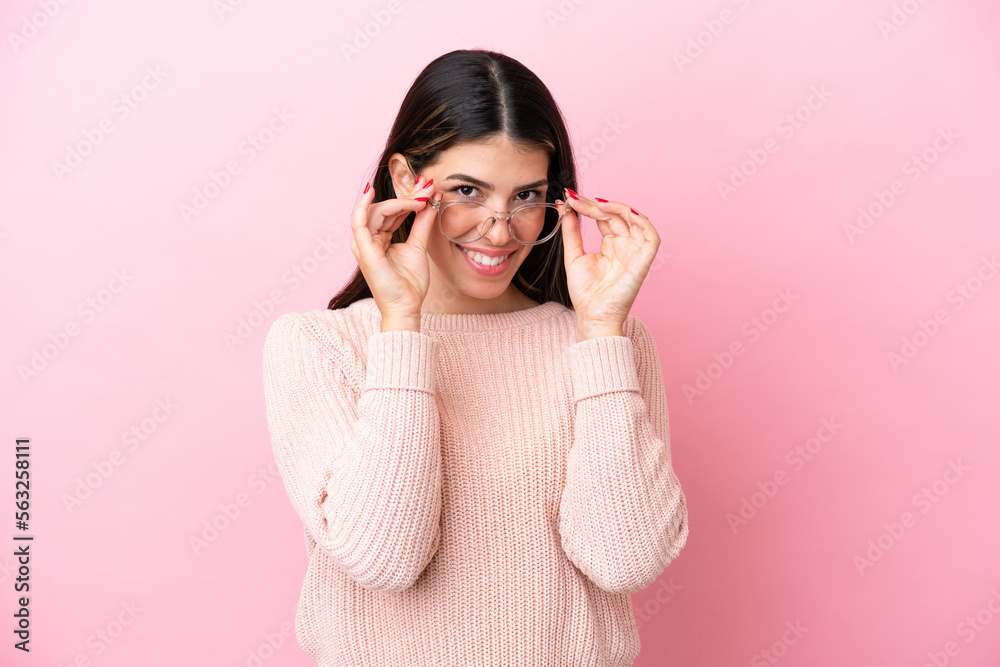 Young Italian woman isolated on pink background With glasses with happy expression Young Italian woman isolated on pink background With glasses with happy expression