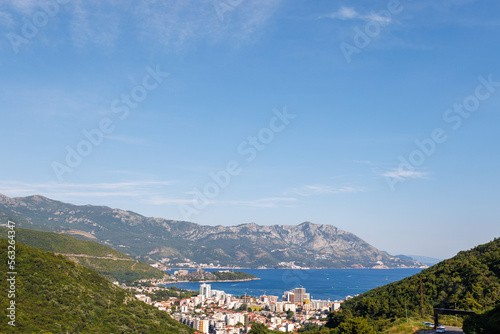 Bird's eye view of towns of Budva and Becici with hotels and beaches near Adriatic Sea against the backdrop of the Montenegrin Mountains © YouraPechkin