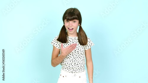 Little girl  gaping because have just surprised with a gift over isolated background