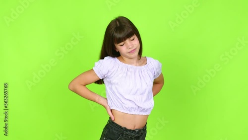 Little girl suffering from pain in shoulder for having made an effort over isolated background