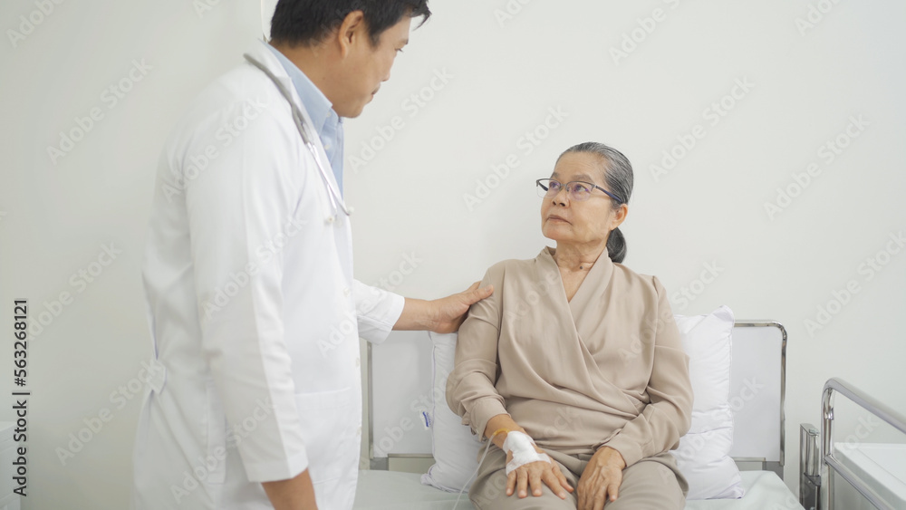 Portrait of Asian doctor check up body of sick old senior elderly patient on bed in hospital in medical and healthcare treatment at nursing home. People lifestyle Portrait of Asian doctor check up body of sick old senior elderly patient on bed in hospital in medical and healthcare treatment at nursing home. People lifestyle