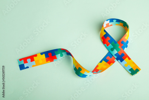World Autism awareness and pride day with Puzzle pattern ribbon