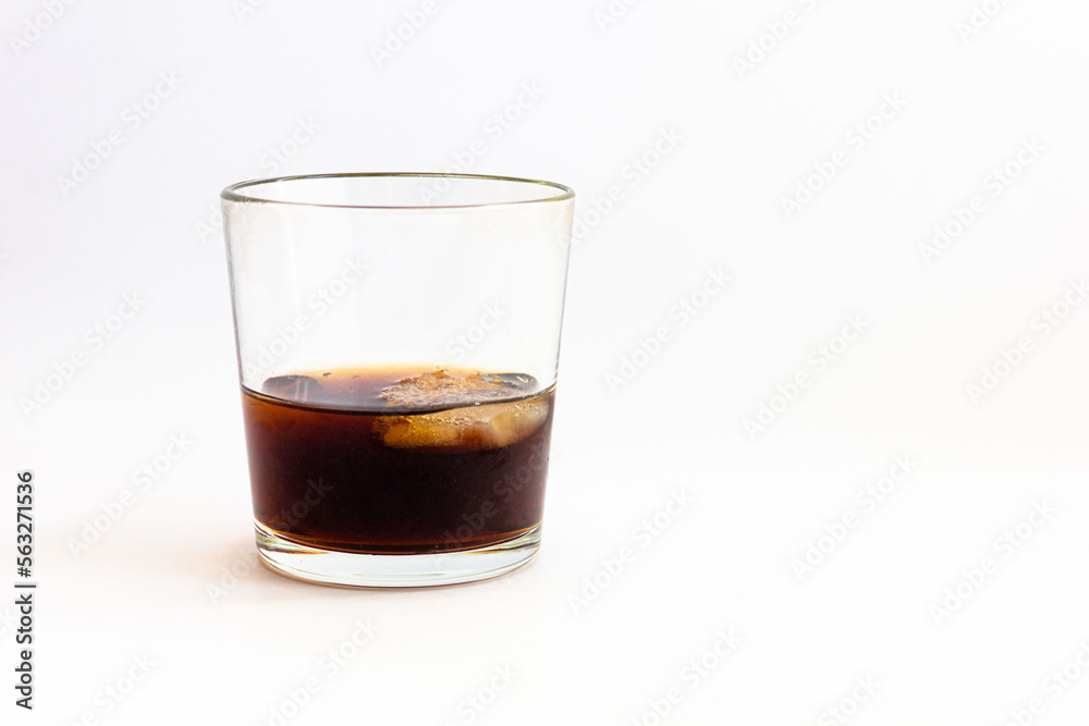 Glass with a drink on a white background.