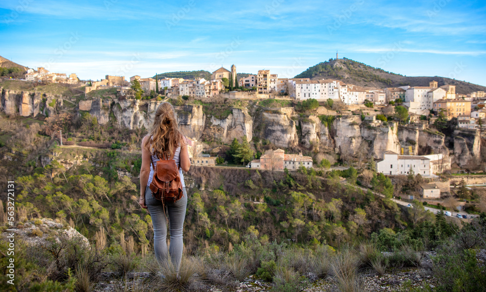 Woman tourist looking at Cuenca (Spain), casas colgadas