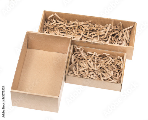 Open сardboard boxes for gifts or package with kraft paper shavings isolated on white background. Corrugated cardboard paper carton cargo container close up. parcels
