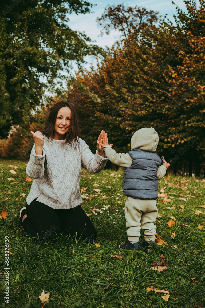 Fototapeta premium happy family mom and son on a walk