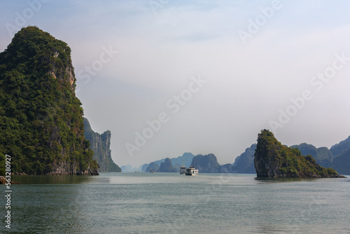 Local boats in the channel south of Hon Van Boi, Ha Long Bay, Quang Ninh, Viet Nam