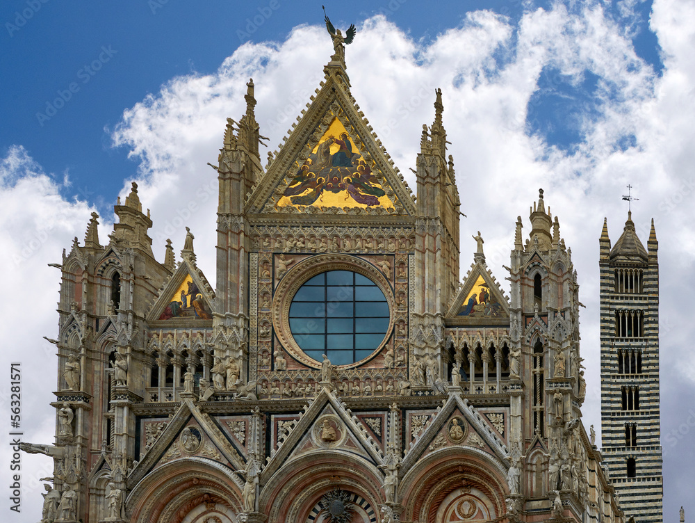 View on the facade of the city cathedral of Siena on a sunny day