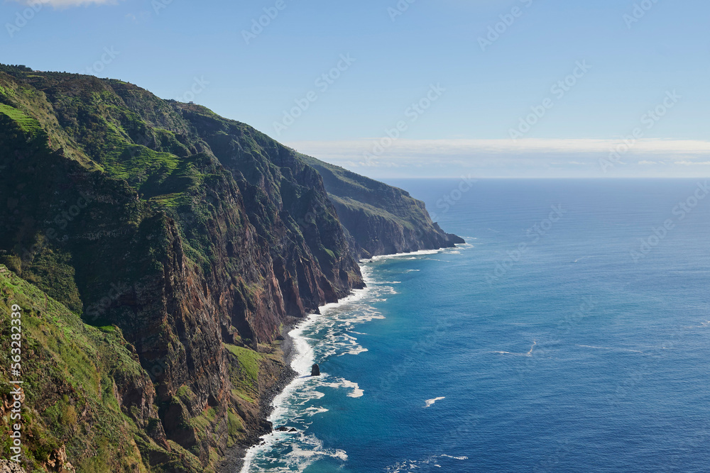 Cliffs, Atlantic Occean and blue sky on sunny day, Madeira, Portugal
