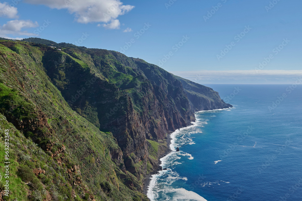Cliffs, Atlantic Occean and blue sky on sunny day, Madeira, Portugal Cliffs, Atlantic Occean and blue sky on sunny day, Madeira, Portugal