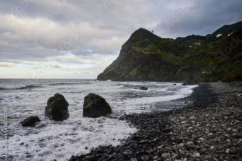 Beach Praia da Maiata on the Atlantic Ocean near village Porto da Cruz, Madeira island, Portugal photo