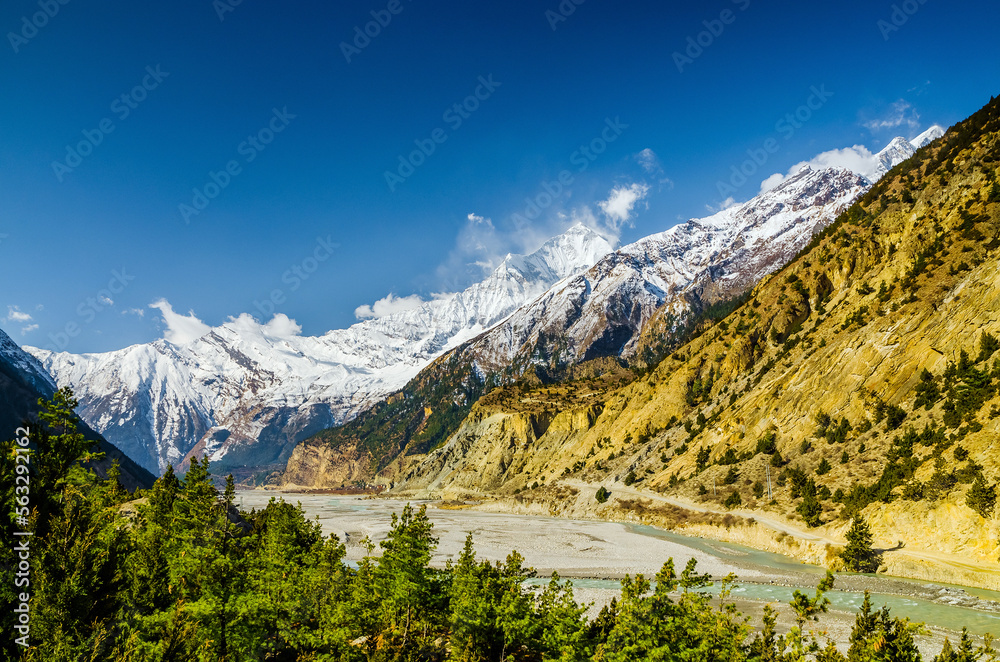 Kali Gandaki valley near Tukuche village with Mt. Dhaulagiri on the horizon. Annapurna circuit / Jomsom trek, Nepal.