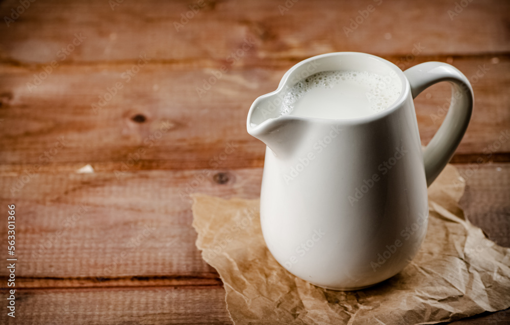 A jug of fresh milk on the table. A jug of fresh milk on the table.