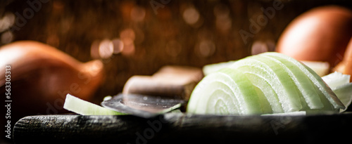 Pieces of onions on a cutting board. 
