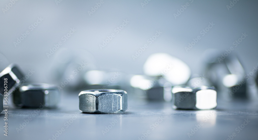 Working tool. Metal nuts on the table. Working tool. Metal nuts on the table.