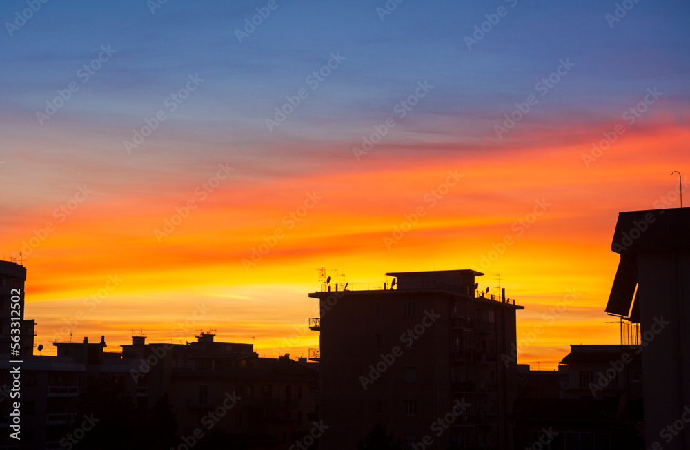 city skyline at sunset with vivid colors