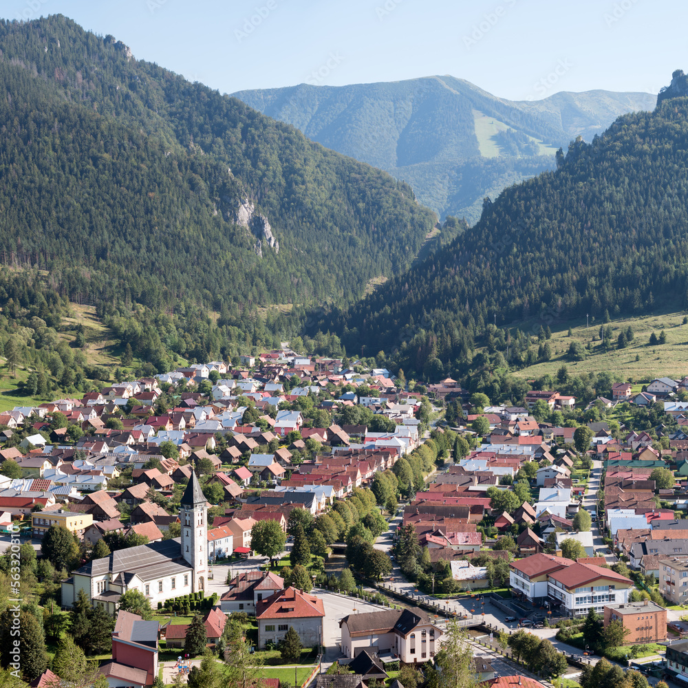 Slovakian village Terchova in a valley between Fatra mountains. Hills and rock, blue sky.