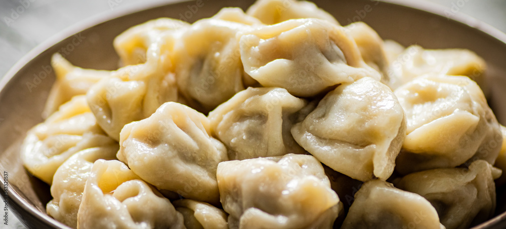 Boiled homemade dumplings on a plate. Boiled homemade dumplings on a plate.