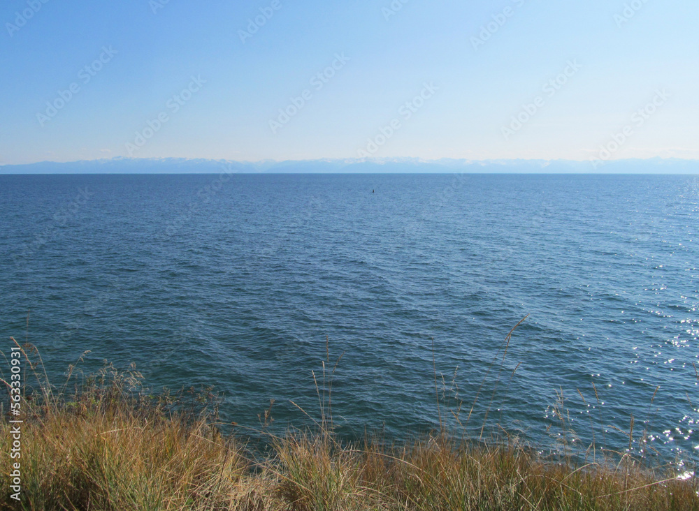 view from the shore to the endless expanse of the cleanest lake on the planet - Baikal view from the shore to the endless expanse of the cleanest lake on the planet - Baikal