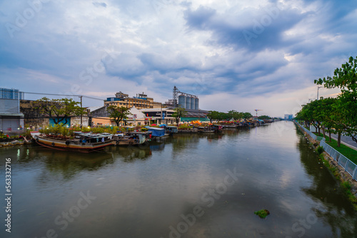 Springtime in Saigon, boat on canal, transport spring flower for Tet to Ben Binh Dong open air market, Vietnamese happy with Lunar New Year, Vietnam