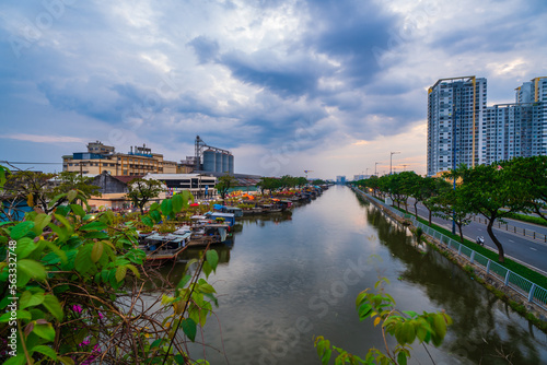 Springtime in Saigon, boat on canal, transport spring flower for Tet to Ben Binh Dong open air market, Vietnamese happy with Lunar New Year, Vietnam